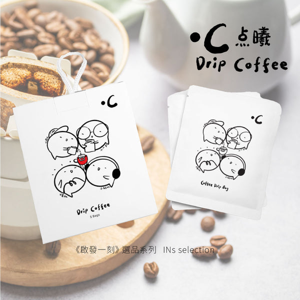 Drip coffee bags with cartoon designs on a wooden coaster with coffee beans and a cup in the background.