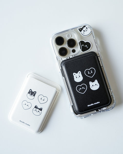 Phone case with cat and heart designs on a white background