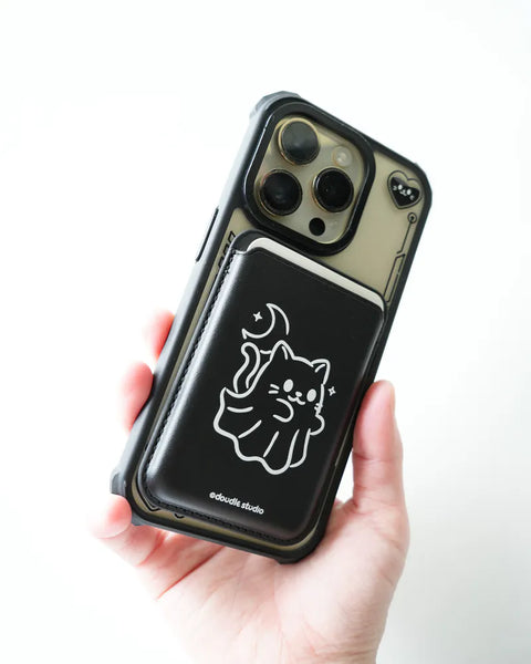Phone case with a cat design held by a hand on a white background