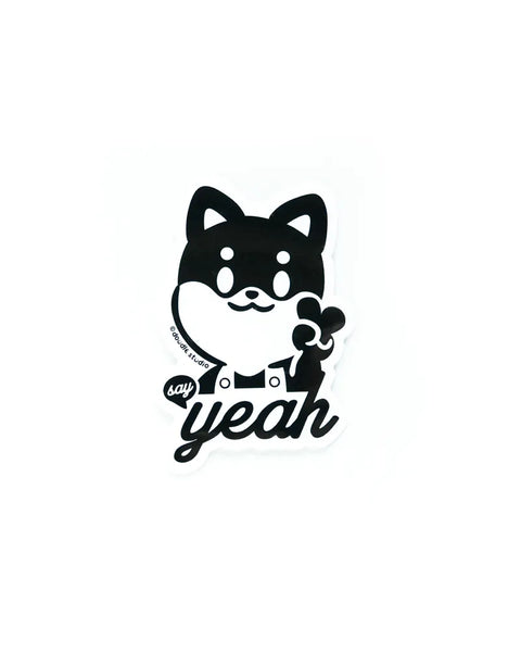 Black and white illustration of a dog with text 'say yeah' on a white background