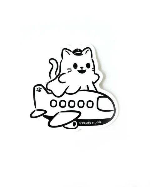 Black and white sticker of a cat on an airplane with 'doodle studio' branding.