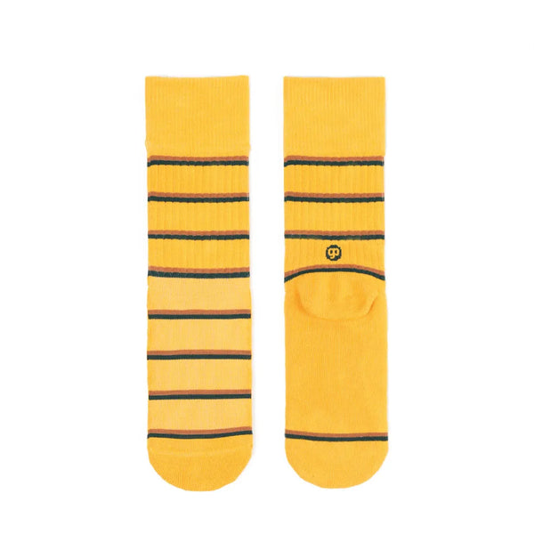 Pair of yellow socks with black stripes on a white background