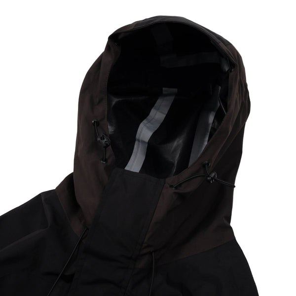 Black hooded jacket on a light gray background