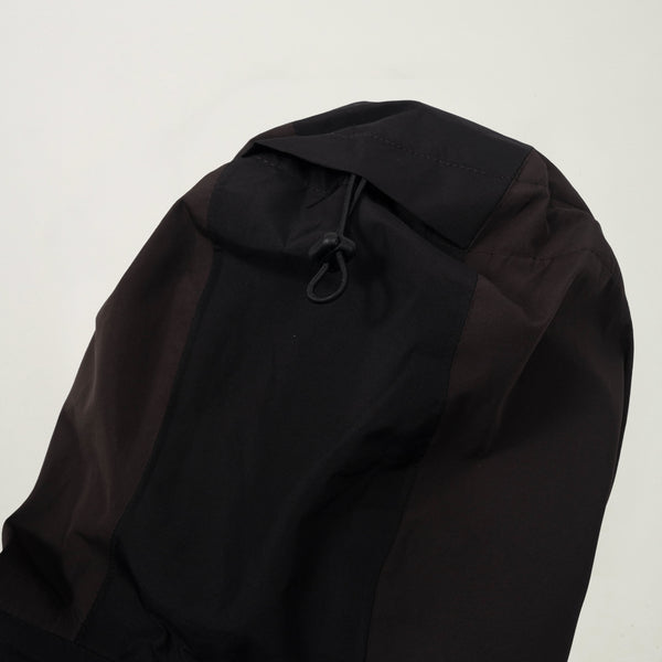 Black jacket with a hood on a light gray background