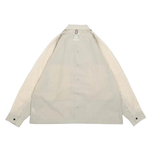 Light gray shirt with cream sleeves on a white background