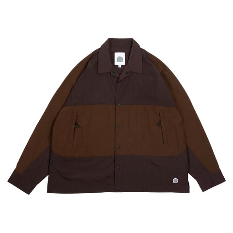 Brown jacket with a patchwork design on a beige background