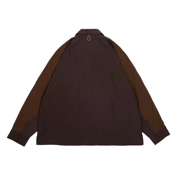 Brown shirt with brown sleeves on a light beige background