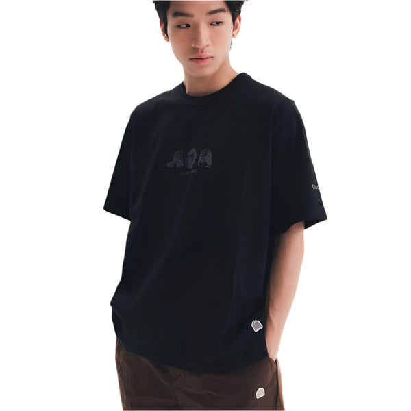 Person wearing a black t-shirt with a logo on a white background