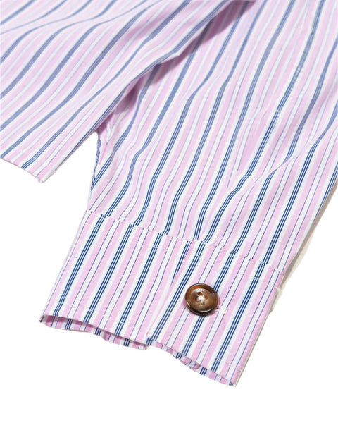 Close-up of a pink and blue striped shirt with a button on a light background