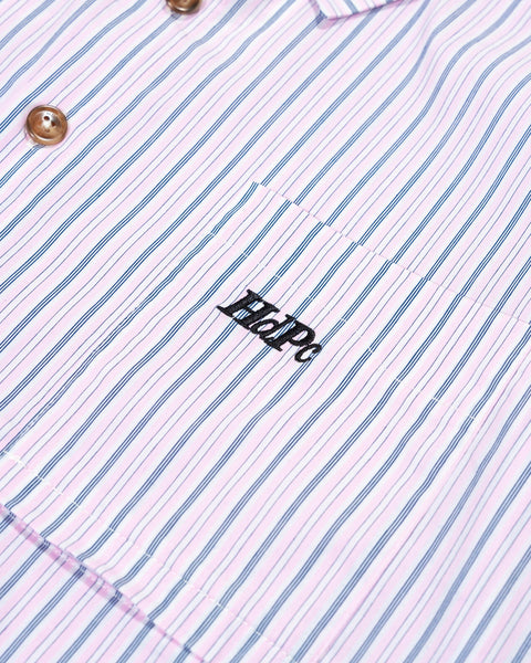 Close-up of a striped shirt with a logo on a white background