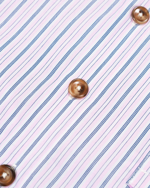 Close-up of a shirt with pink and blue striped pattern and brown buttons.