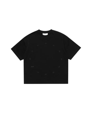 Black t-shirt with small white patterns on a light gray background