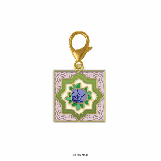 Decorative pendant with floral design on a white background