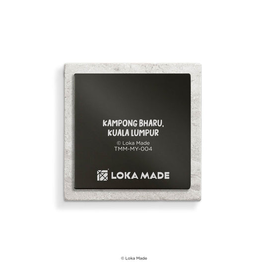 Square coaster with black center and white text displaying 'Kampong Bharu, Kuala Lumpur' and 'Loka Made' branding.