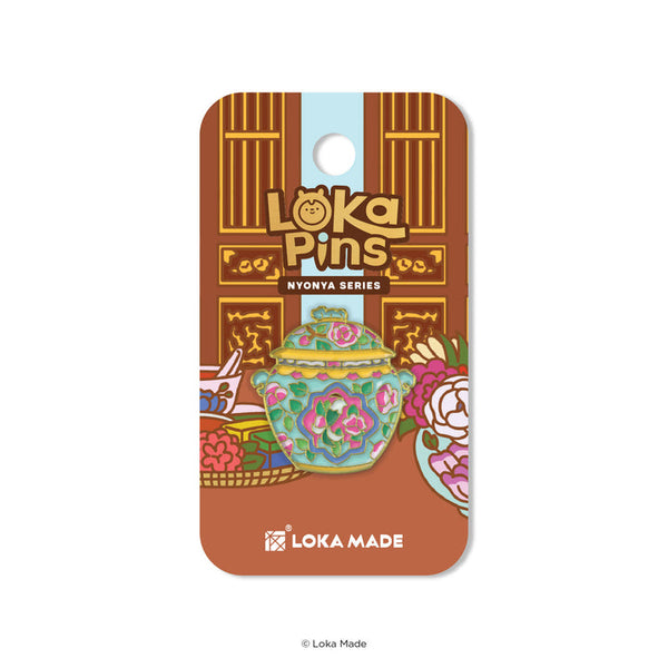 Loka Pins Nyonya Series packaging with a decorative teapot illustration on a brown background