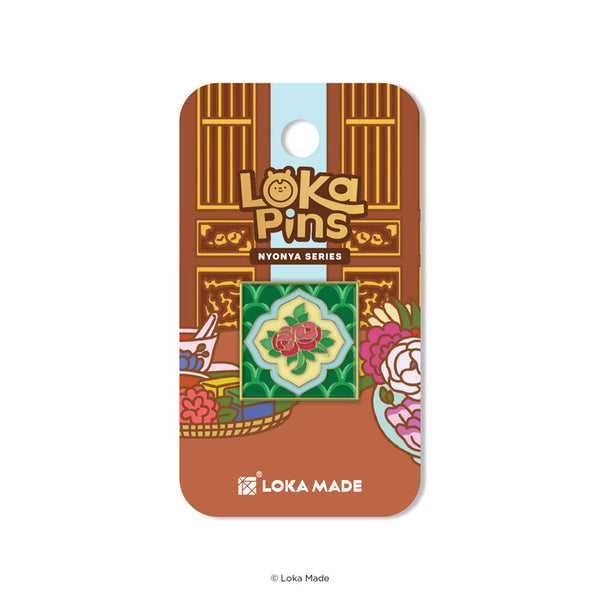 Loka Pins Nyonya Series pin on a brown card with Loka Made branding