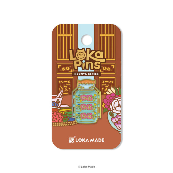 Loka Pins Nyonya Series pin on a brown card with Loka Made branding