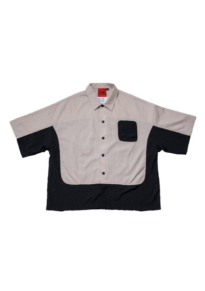 Two-tone shirt with beige and black design on a white background