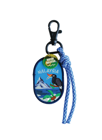Keychain with Malaysia design featuring a bird and mountain, attached to a blue rope.
