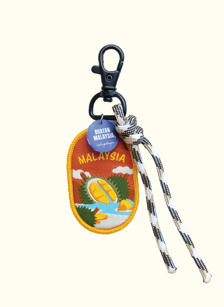 Keychain with Malaysia design and durian illustration on a white background