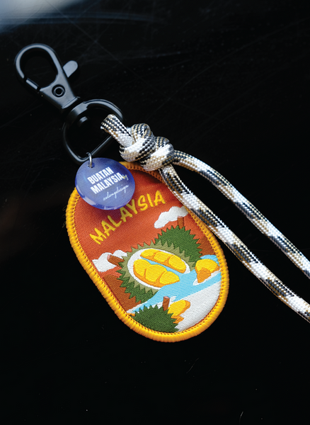 Keychain with Malaysia patch featuring durian fruit on a dark background