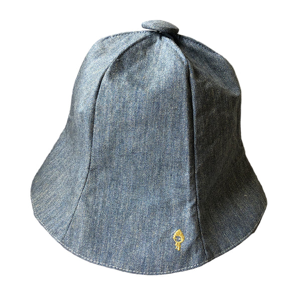 Blue denim bucket hat with a small logo on a white background